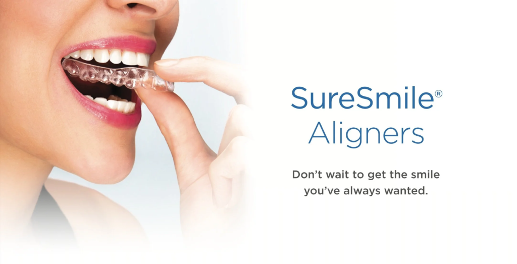 SureSmile clear aligners being inserted by smiling female patient, with promotional text &ldquo;Don&rsquo;t wait to get the smile you&rsquo;ve always wanted.